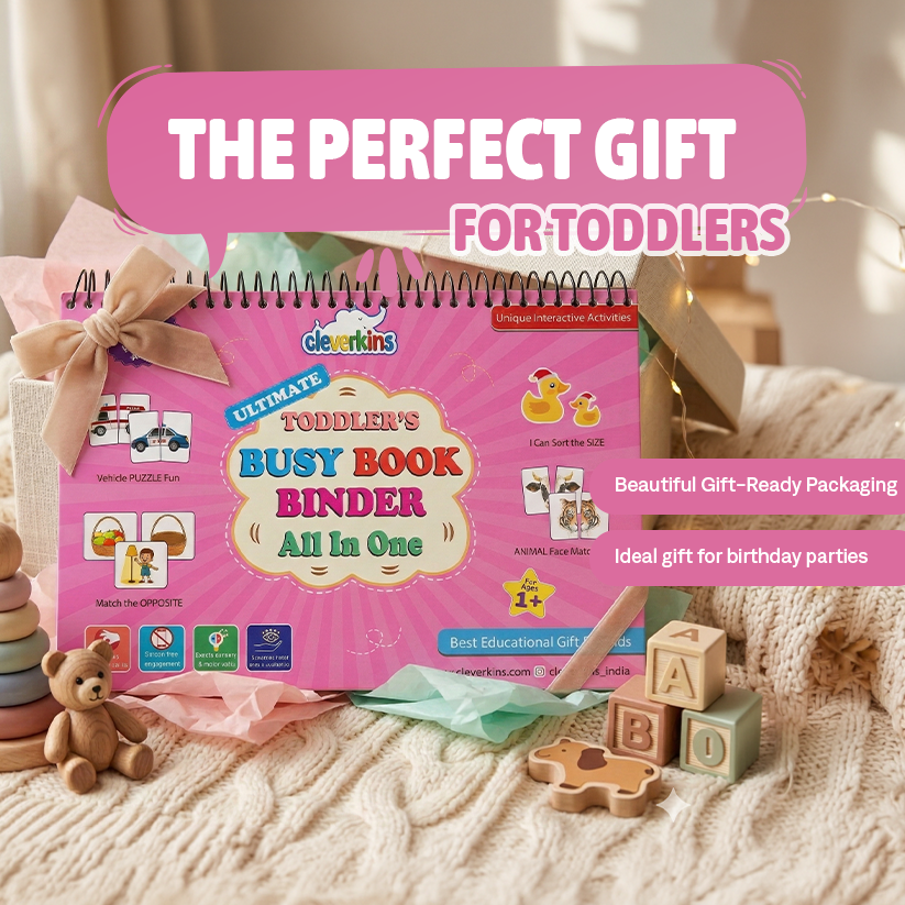 Pink 'Busy Book Binder' for toddlers with educational toys on a soft surface
