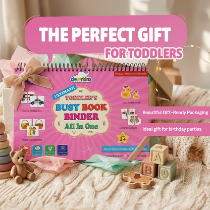 Pink 'Busy Book Binder' for toddlers with educational toys on a soft surface