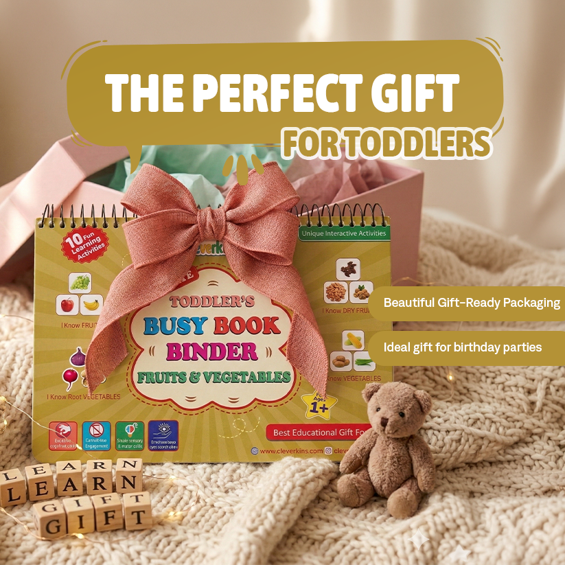 Toddler's busy book binder with a bow, teddy bear, and educational blocks on a soft surface.