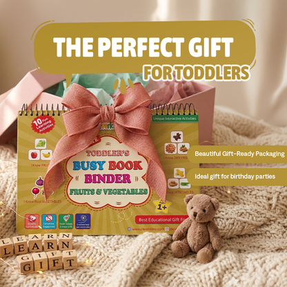 Toddler's busy book binder with a bow, teddy bear, and educational blocks on a soft surface.