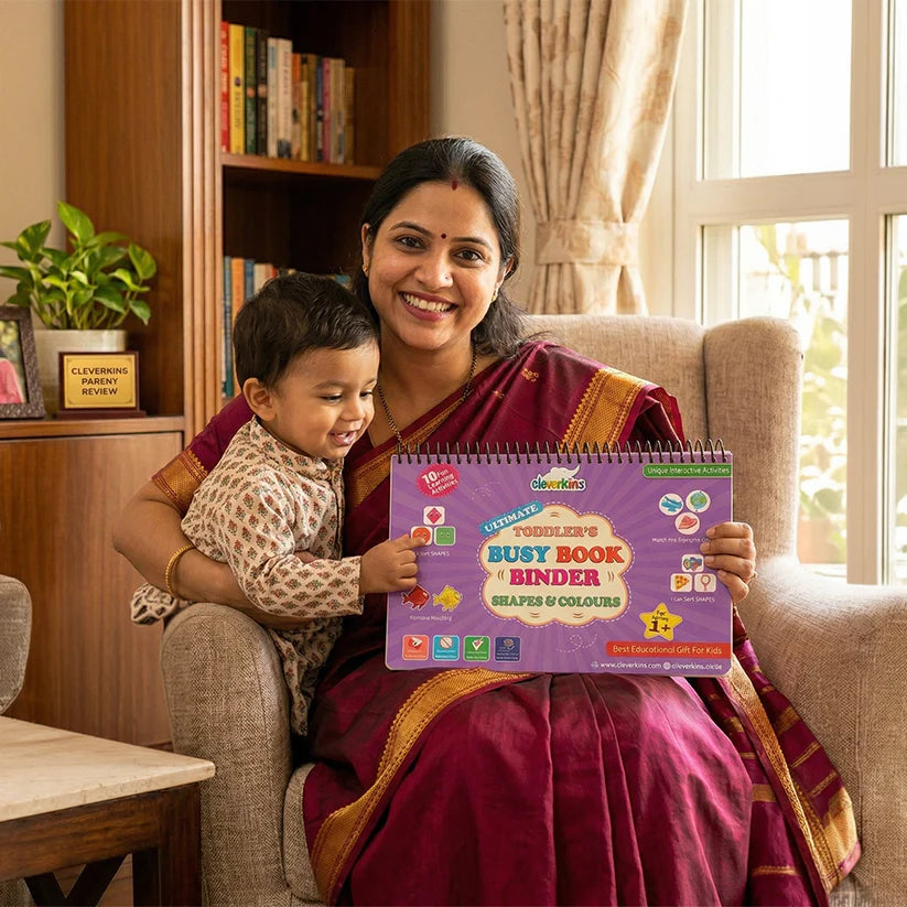 Woman holding a child and a Busy Book Binder in a home setting
