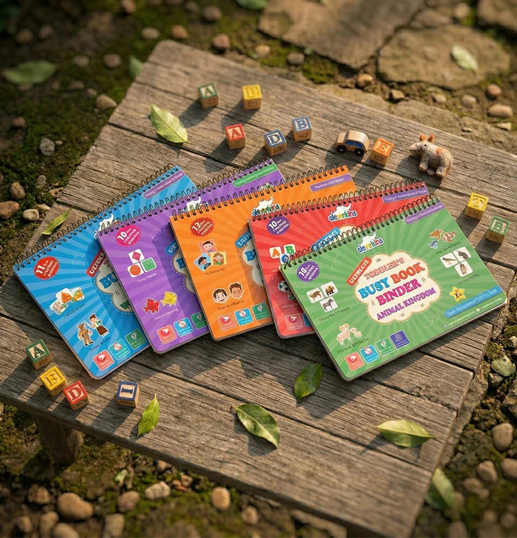 Colorful children's activity books on a wooden surface with scattered letters and toys.